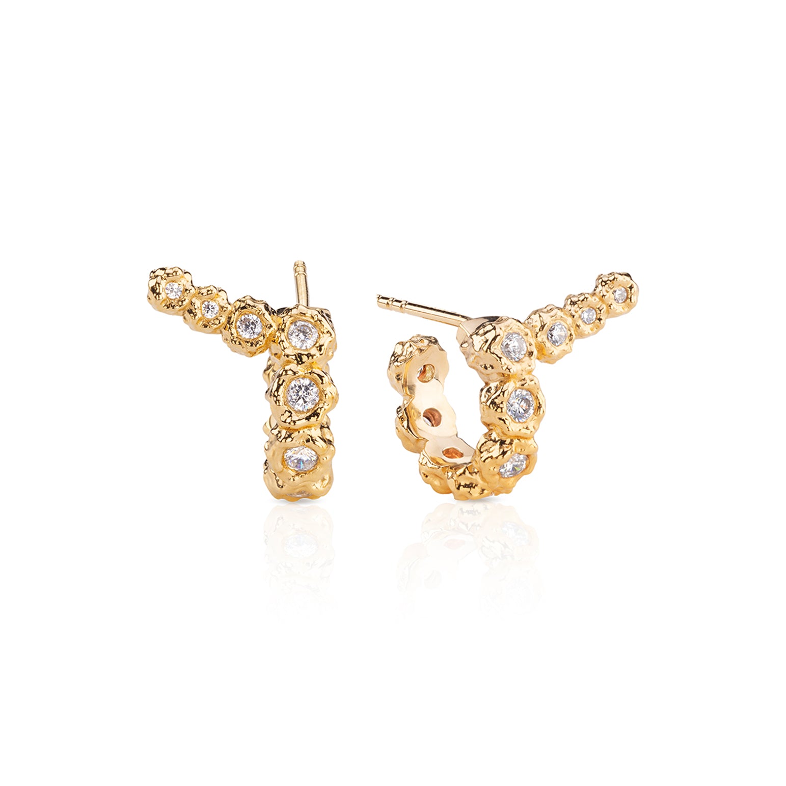 Rose gold diamond-studded hoop and climber earrings.
