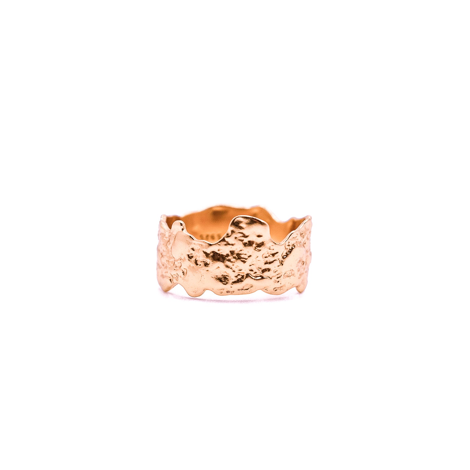 Rose gold wide band ring with an uneven, rugged texture.