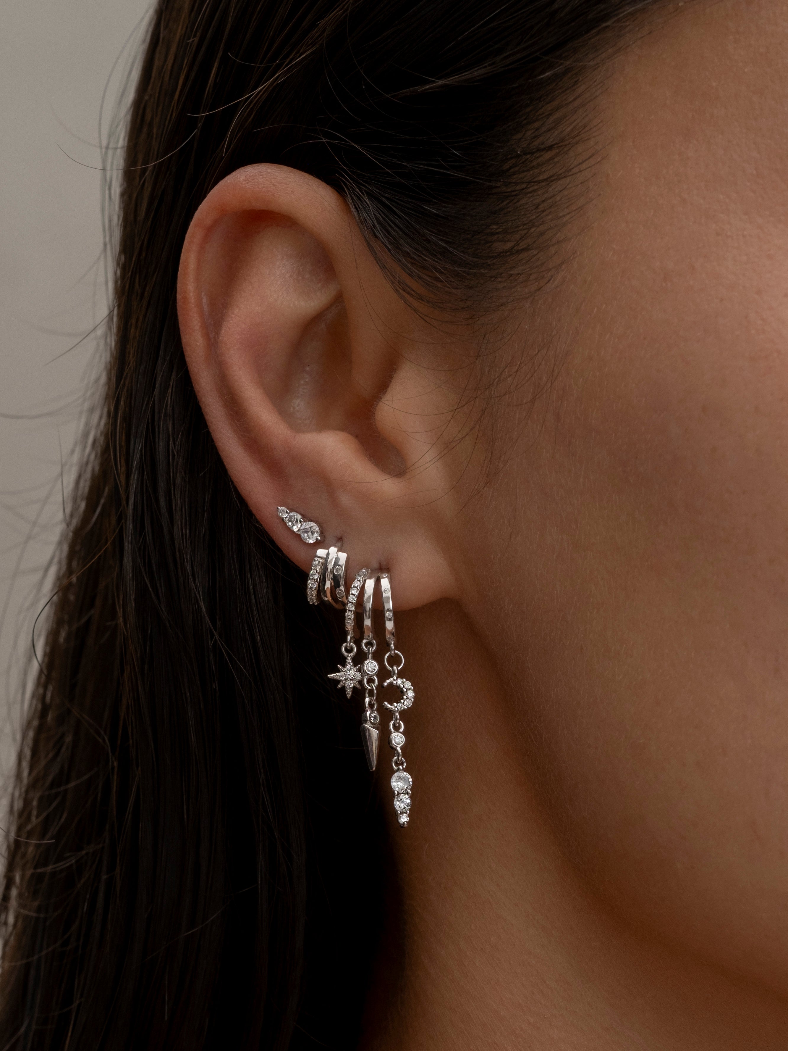 Silver multi-hoop earrings with dangling charms