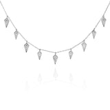 Silver necklace with diamond-shaped charms on a fine chain.