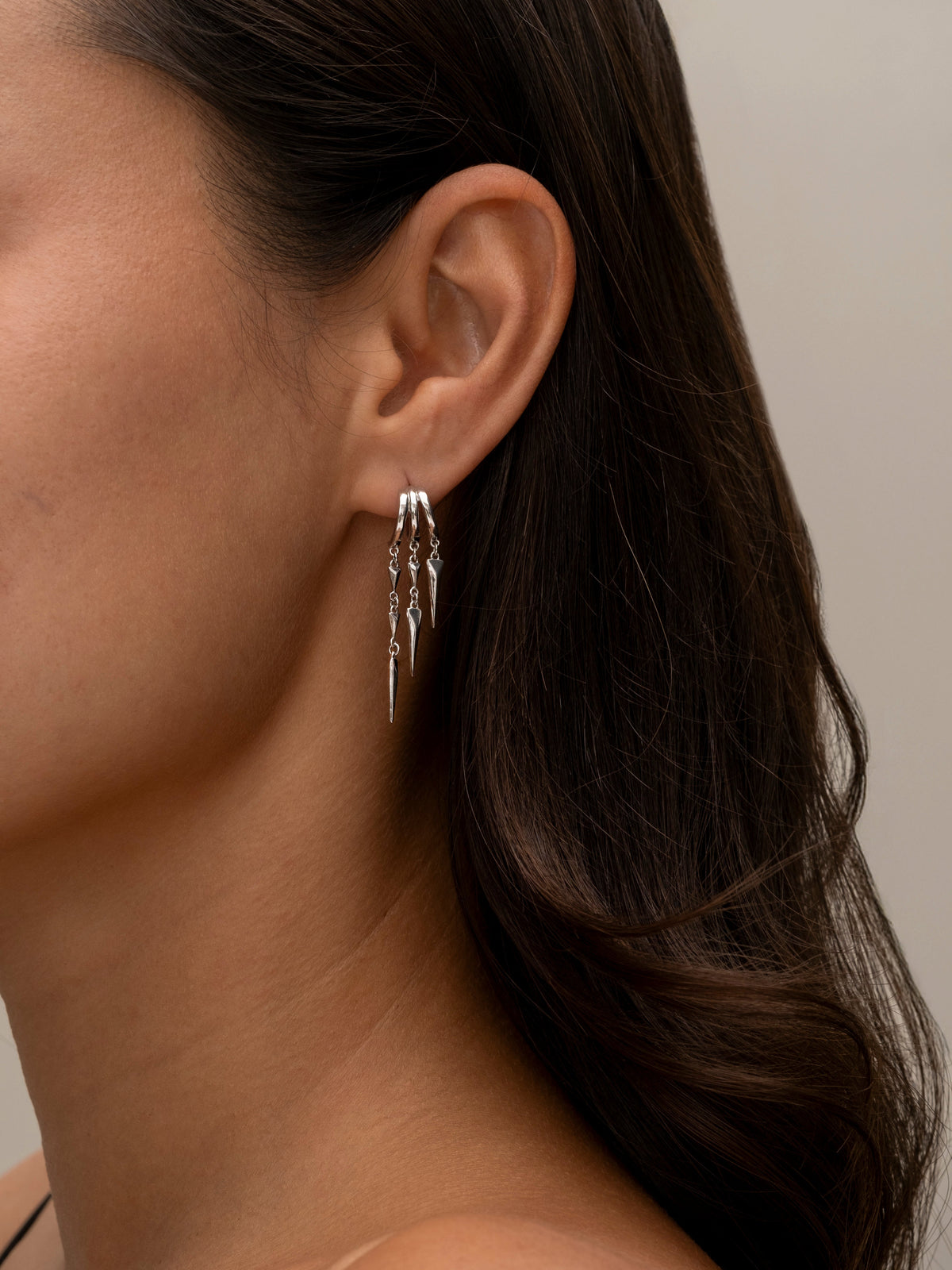 Silver Paloma hoop earrings with dangling geometric spike charms 2