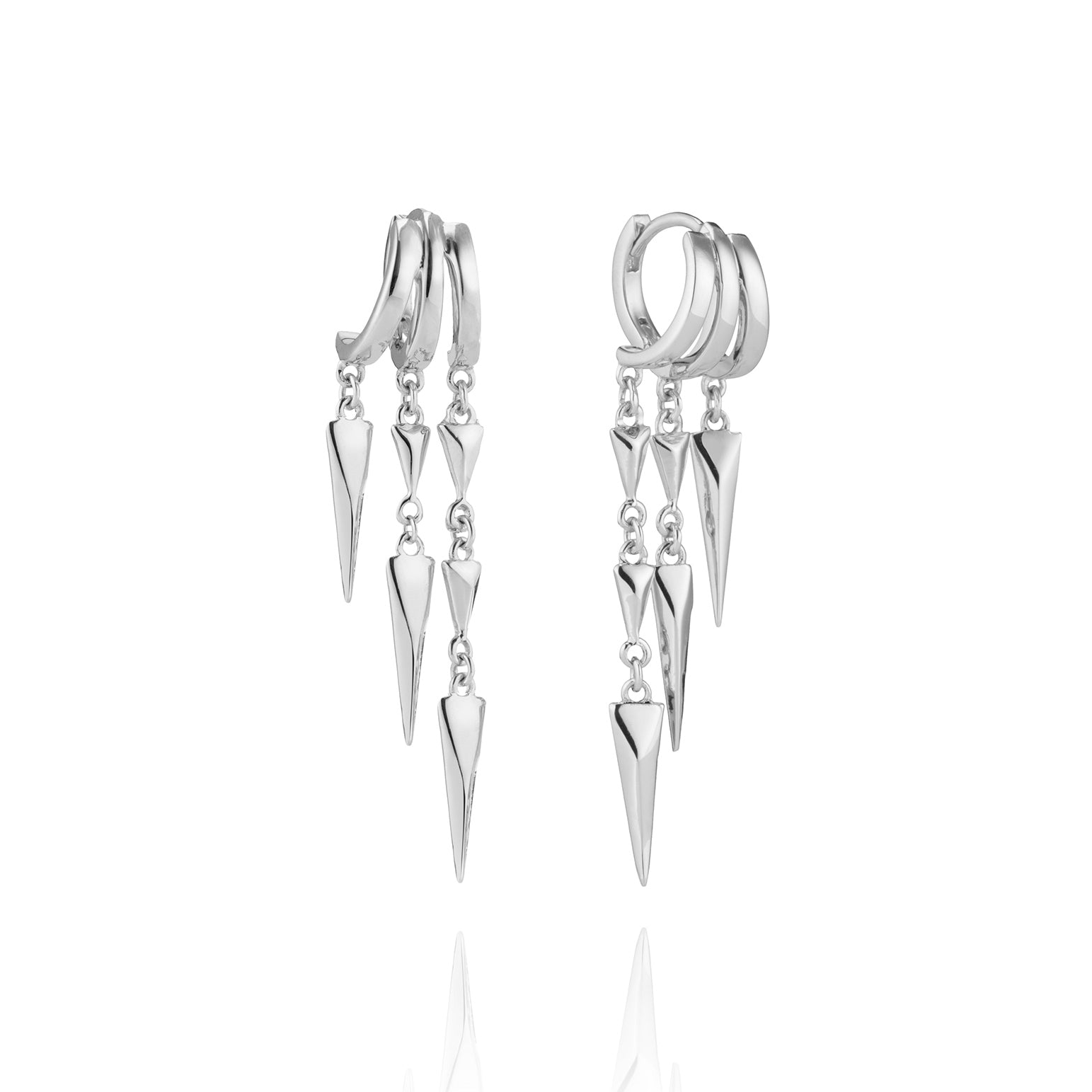 A pair of silver illusion earrings with dangling geometric spike charms, displayed on a white background.