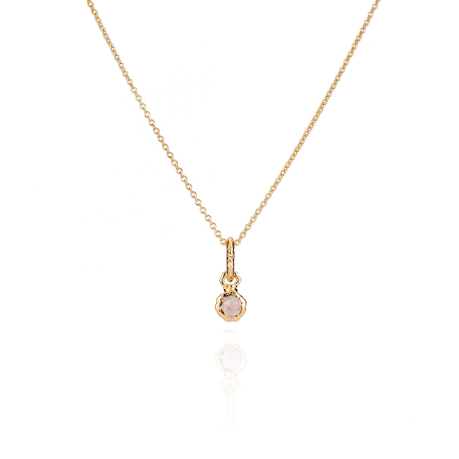 Sahara Mini gold necklace with a round gemstone pendant.