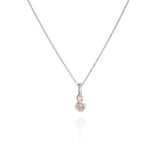 A silver necklace with a round gemstone pendant.
