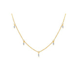 Gold chain necklace with dangling gemstones.
