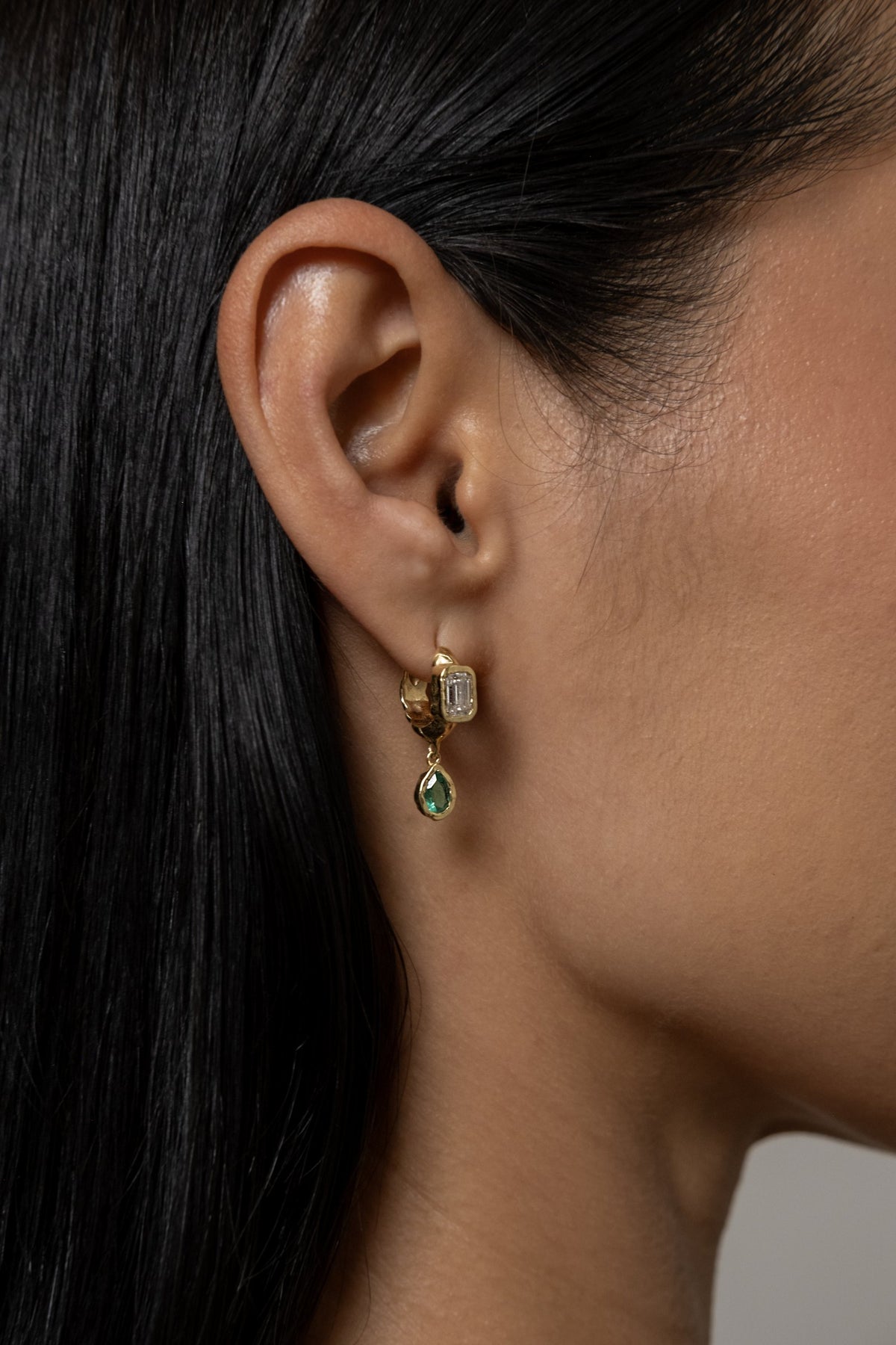 Model wearing Brooke Earrings (lab emerald)