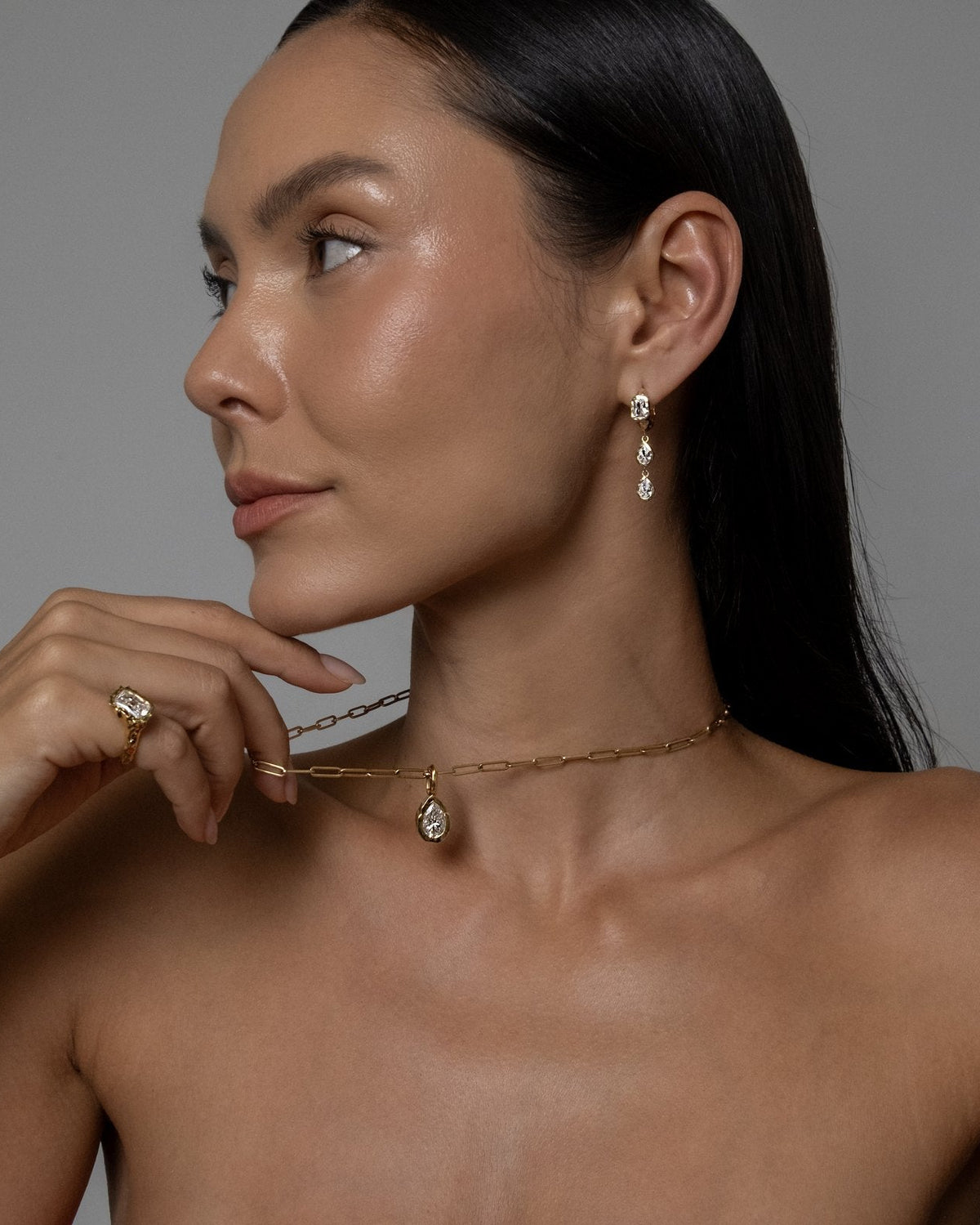 Model wearing Brooklyn Earrings (moissanite), Molten Pear Pendant (moissanite), Paperlink Chain
