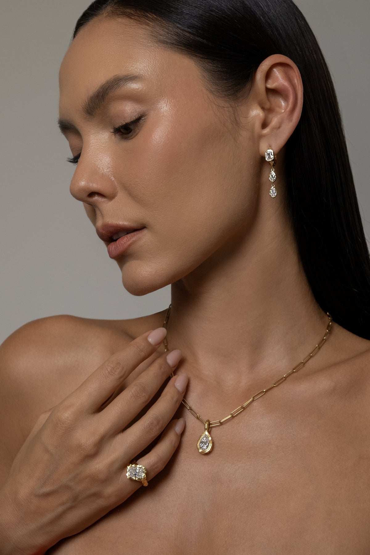Model wearing Brooklyn Earrings (moissanite), Molten Pear Pendant (moissanite), Paperlink Chain, Molten Square Ring (moissanite)