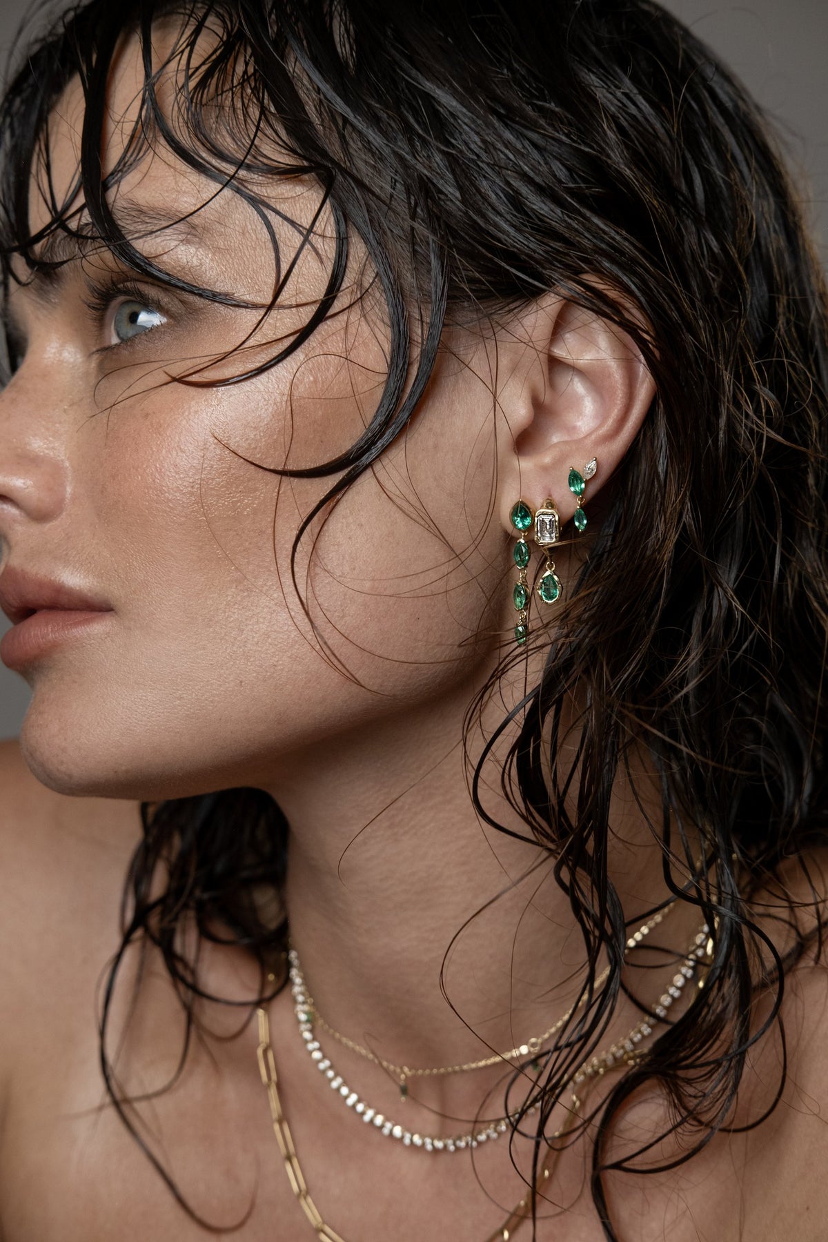 Model wearing Klea Earrings (lab emerald), Brooke Earrings (lab emerald), Alma Earring (lab emerald), Mia Drop Necklace (lab emerald), Paperlink Chain