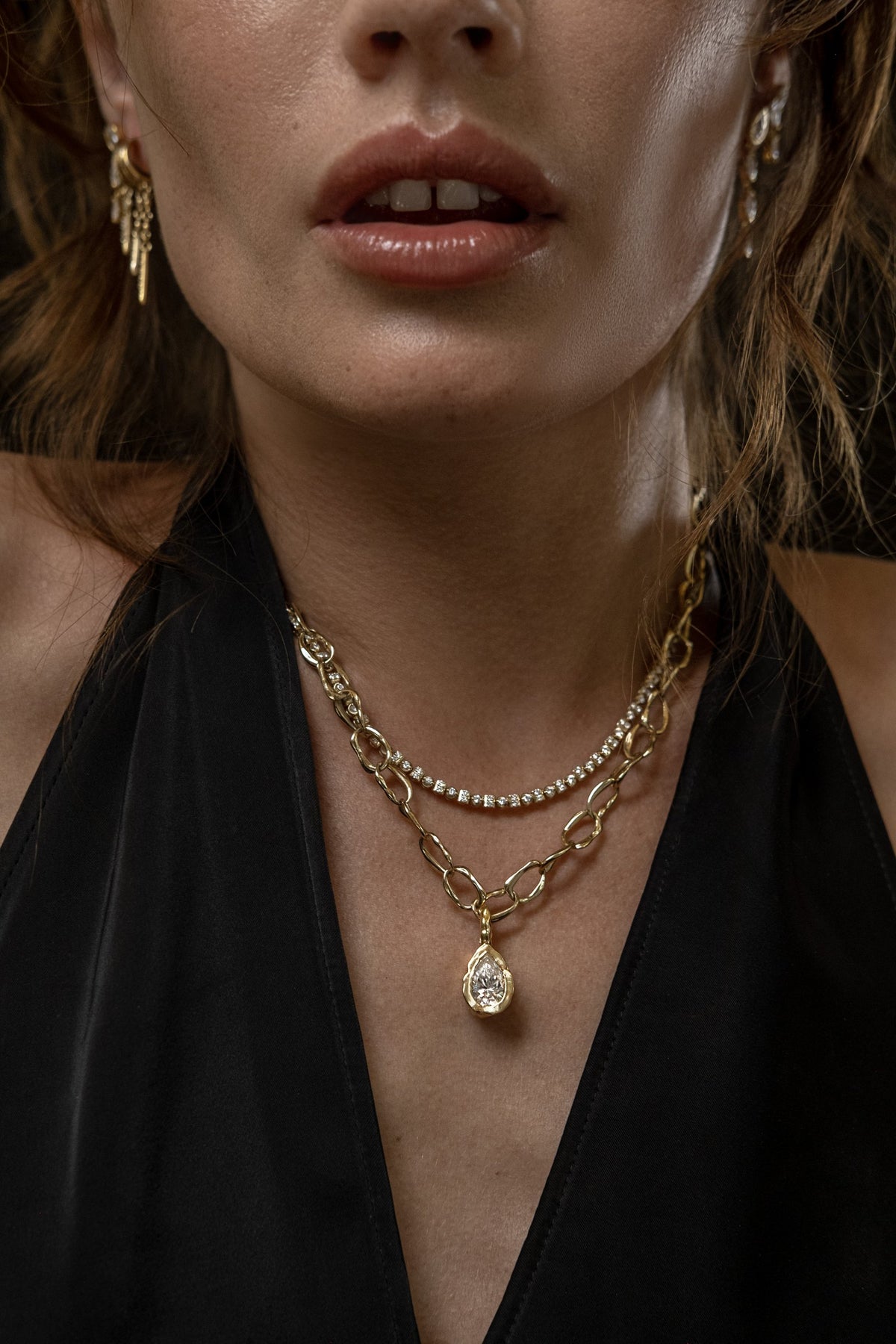 Model wearing Molten Pear Pendant (moissanite), Mini Monaco Necklace