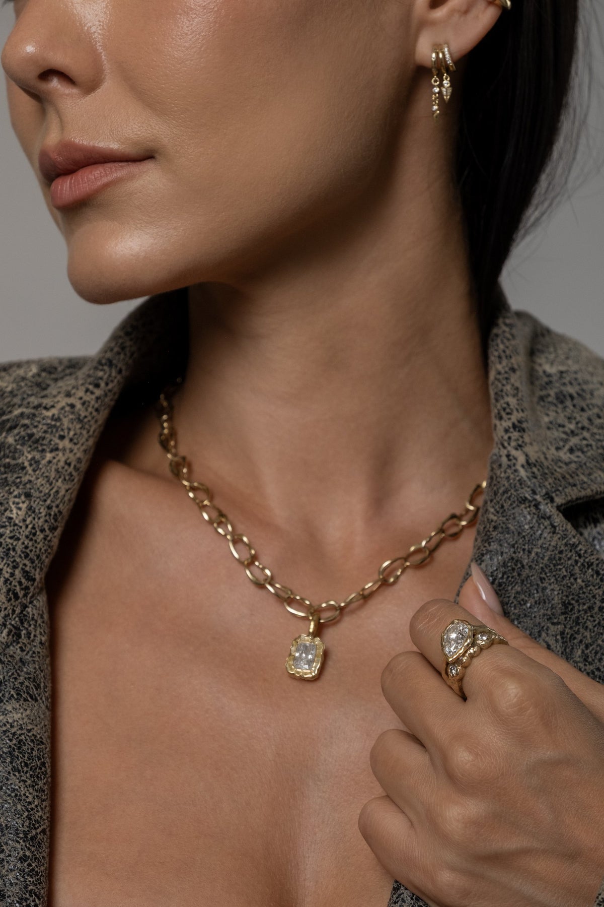 Model wearing Molten Square Pendant (moissanite), Mini Monaco Necklace, Molten Pear Ring (moissanite)