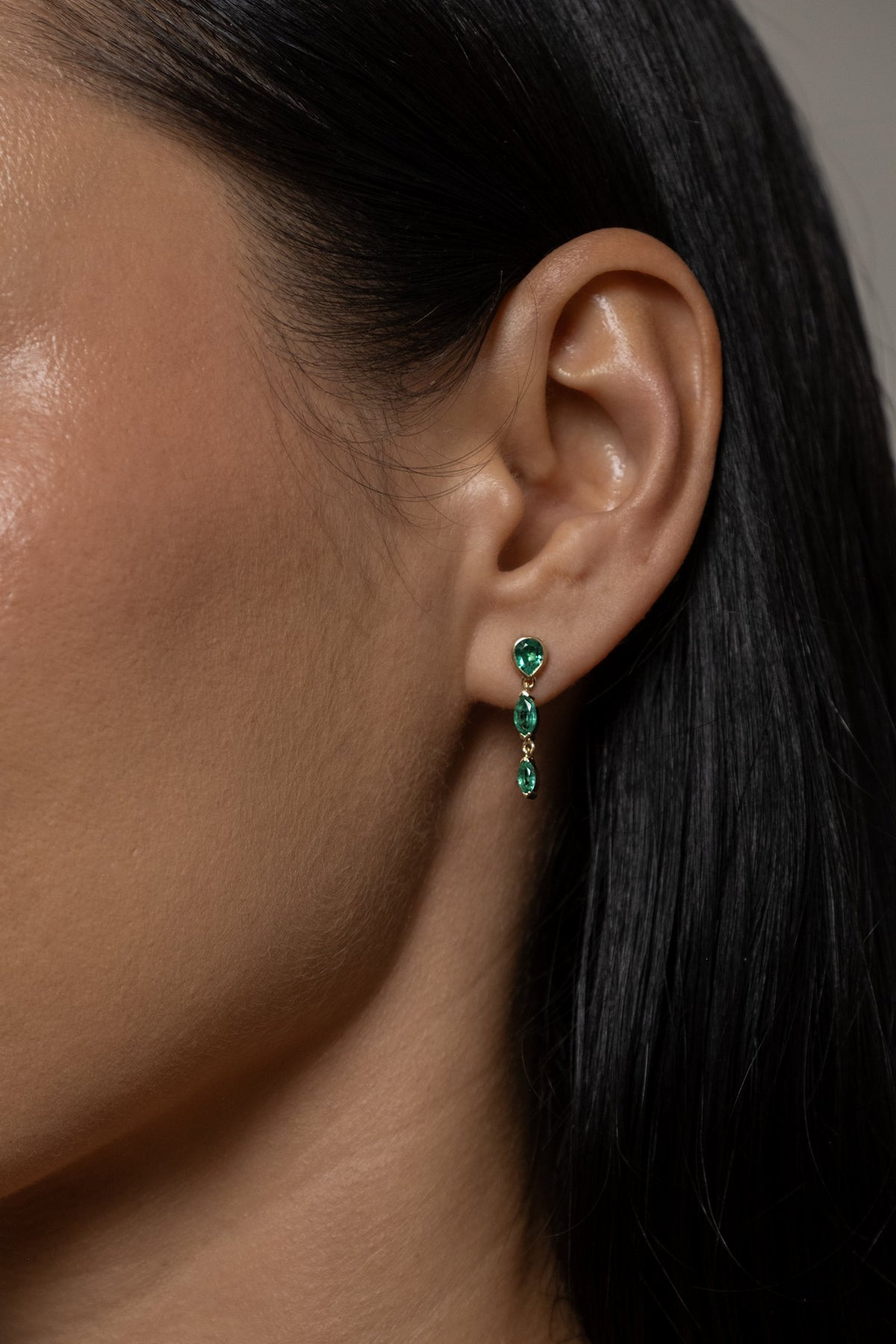Model wearing Roma Earring (lab emerald)