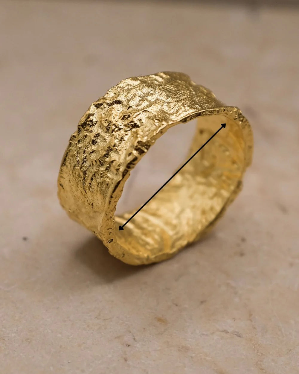 Aaria London textured gold ring with organic design, featuring an inner diameter measurement for size reference.