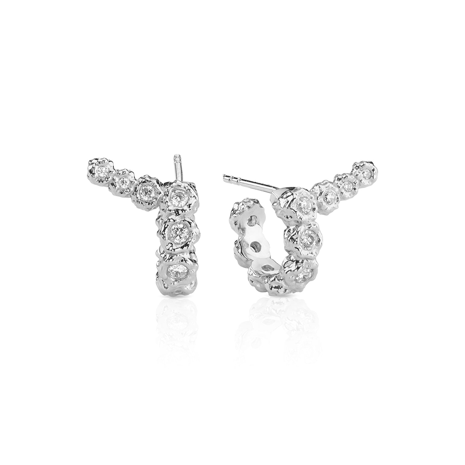 White gold diamond-studded hoop and climber earrings.