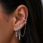 Silver layered ear cuff set with chains and crystals, crafted for a bold statement. 