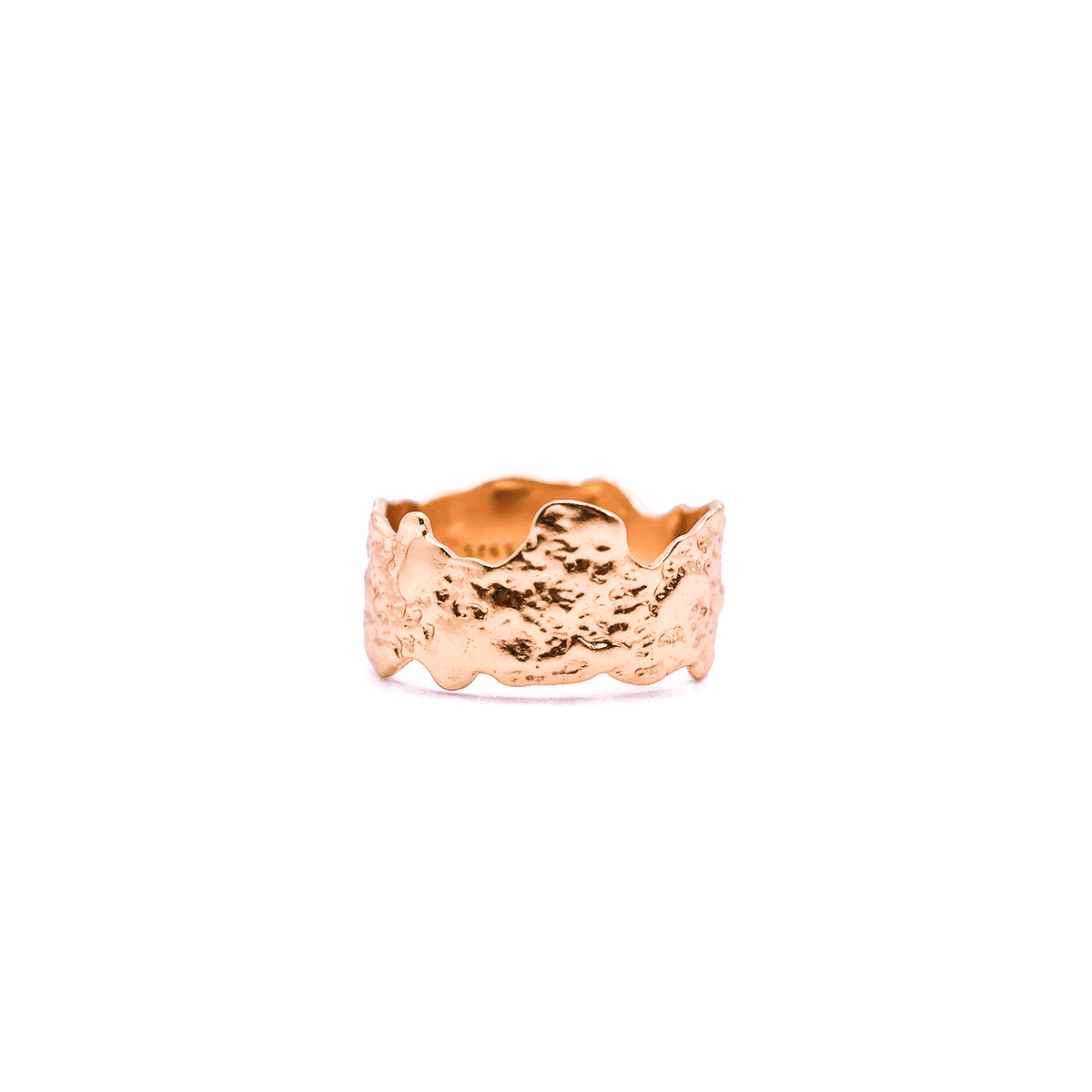 Rose gold wide band ring with an uneven, rugged texture.