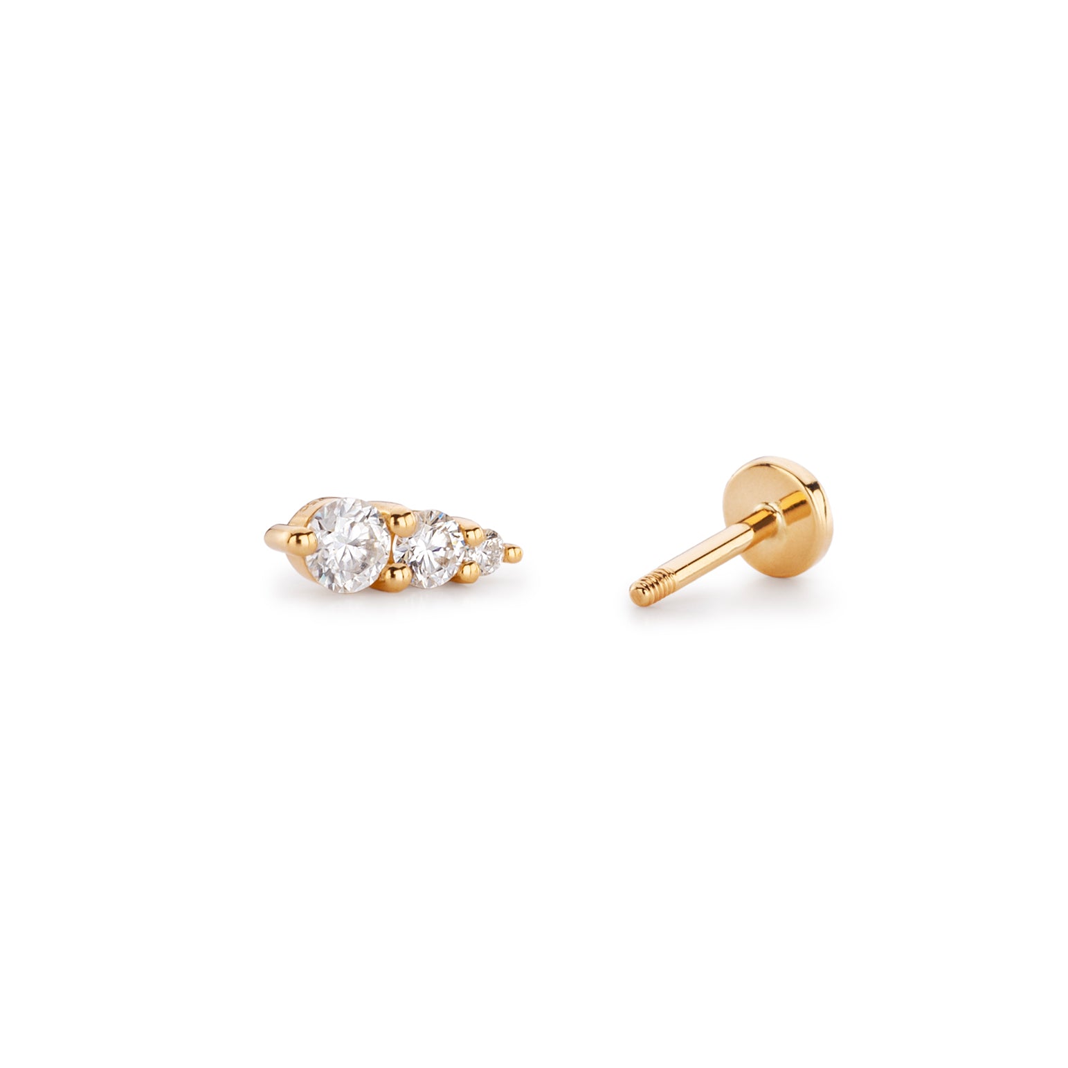 Gold stud earrings with three sparkling gemstones.