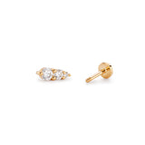 Gold stud earrings with three sparkling gemstones.