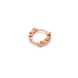 A rose gold Milano hoop earring with bezel-set gemstones.