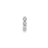 Close up of silver Milano hoop earring with bezel-set gemstones.