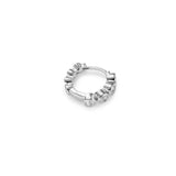 A silver Milano hoop earring with bezel-set gemstones.