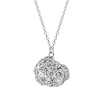 Silver pendant necklace with textured organic-shaped charm.