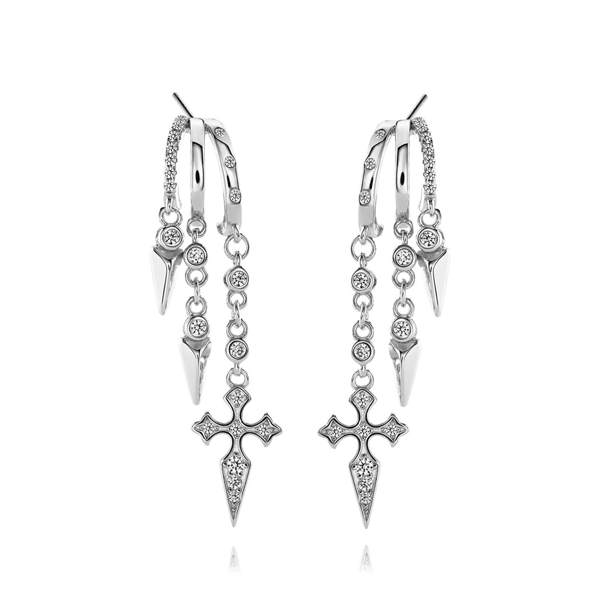 Silver dangling earrings with cross and spike details.