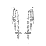 Elegant silver hoop earrings featuring gothic cross and spike charms with sparkling stones.