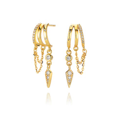 Gold hoop earrings with chains and pointed crystal drops.