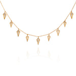 Gold necklace with diamond-shaped charms on a fine chain 2