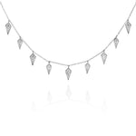 Silver necklace with diamond-shaped charms on a fine chain.
