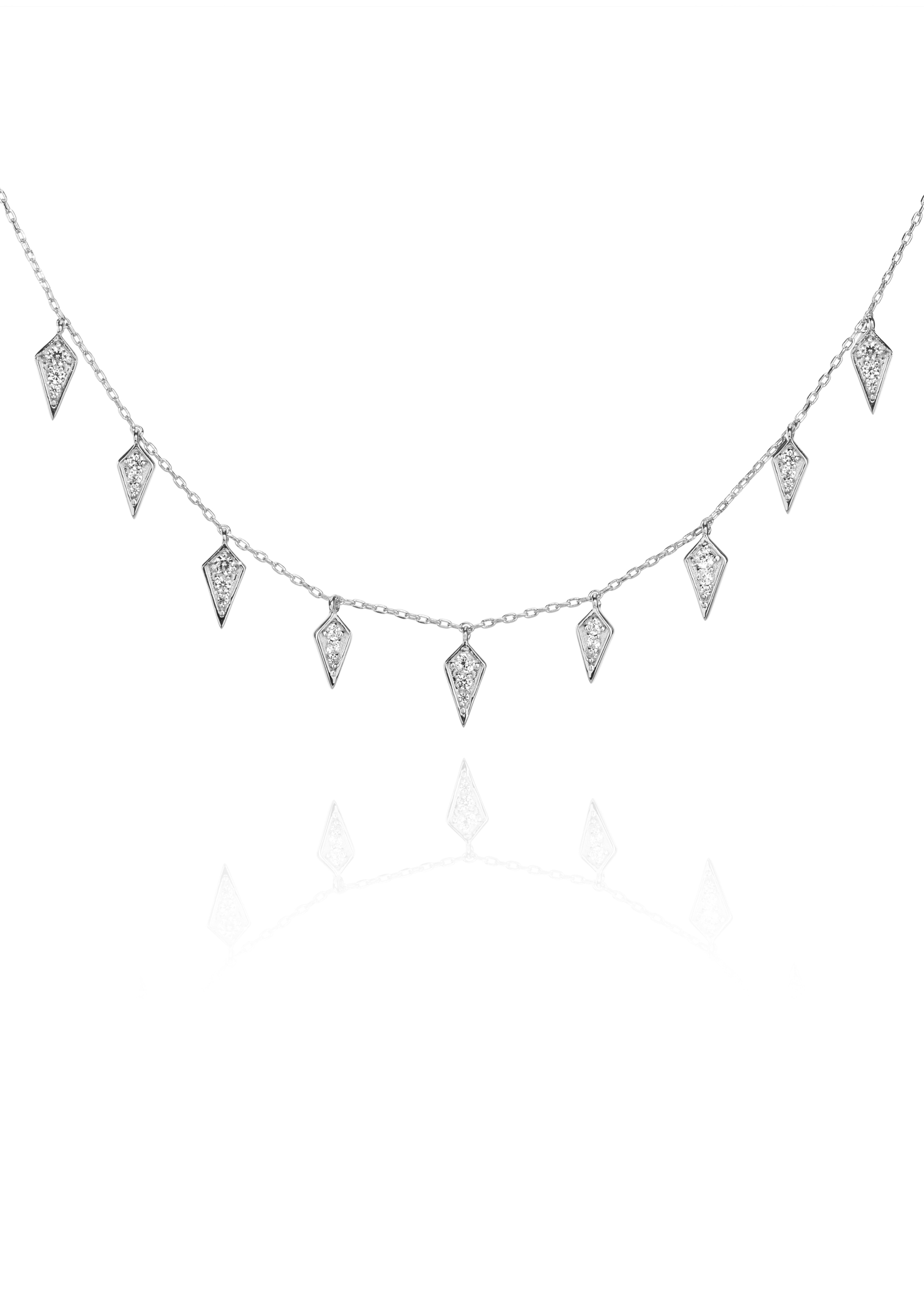 Silver necklace with diamond-shaped charms on a fine chain.