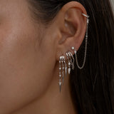 Paloma Silver ear cuff with chain and spike earrings close-up.