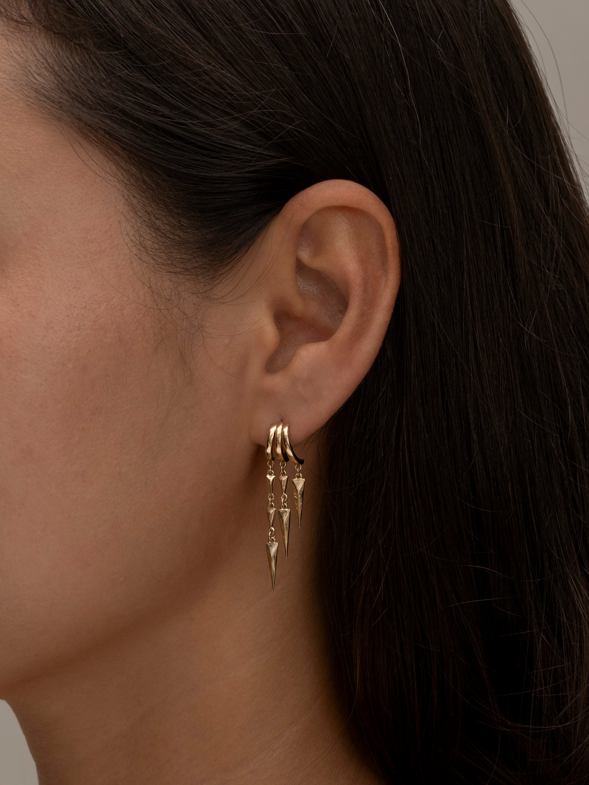 Gold Paloma hoop earrings with dangling geometric spike charms 2