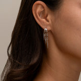 Silver Paloma hoop earrings with dangling geometric spike charms 2