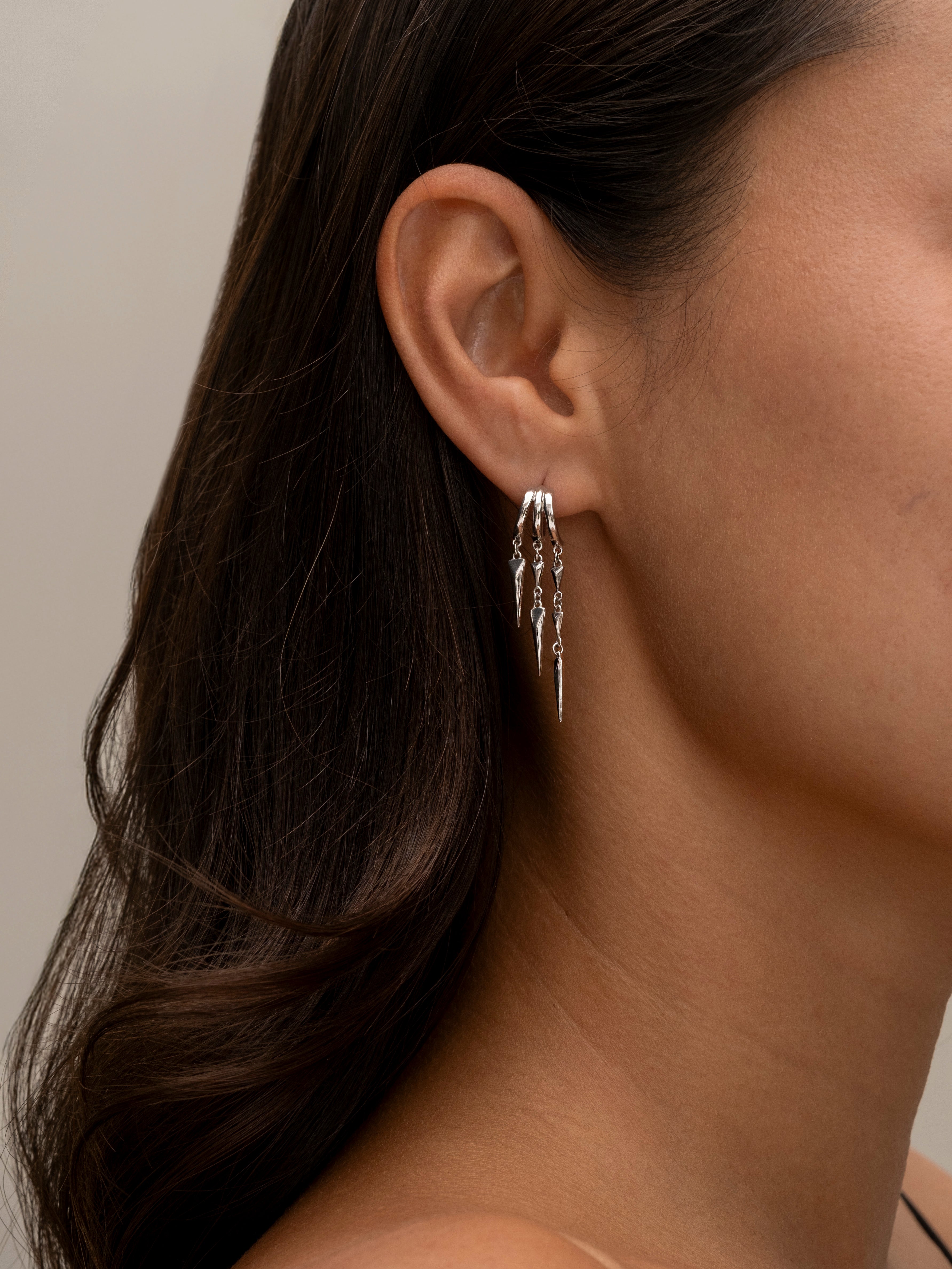 Silver Paloma hoop earrings with dangling geometric spike charms 2