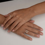 Hands adorned with delicate gold and diamond rings 2