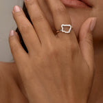 Women wear Silver ring with an open, irregular diamond-shaped design.