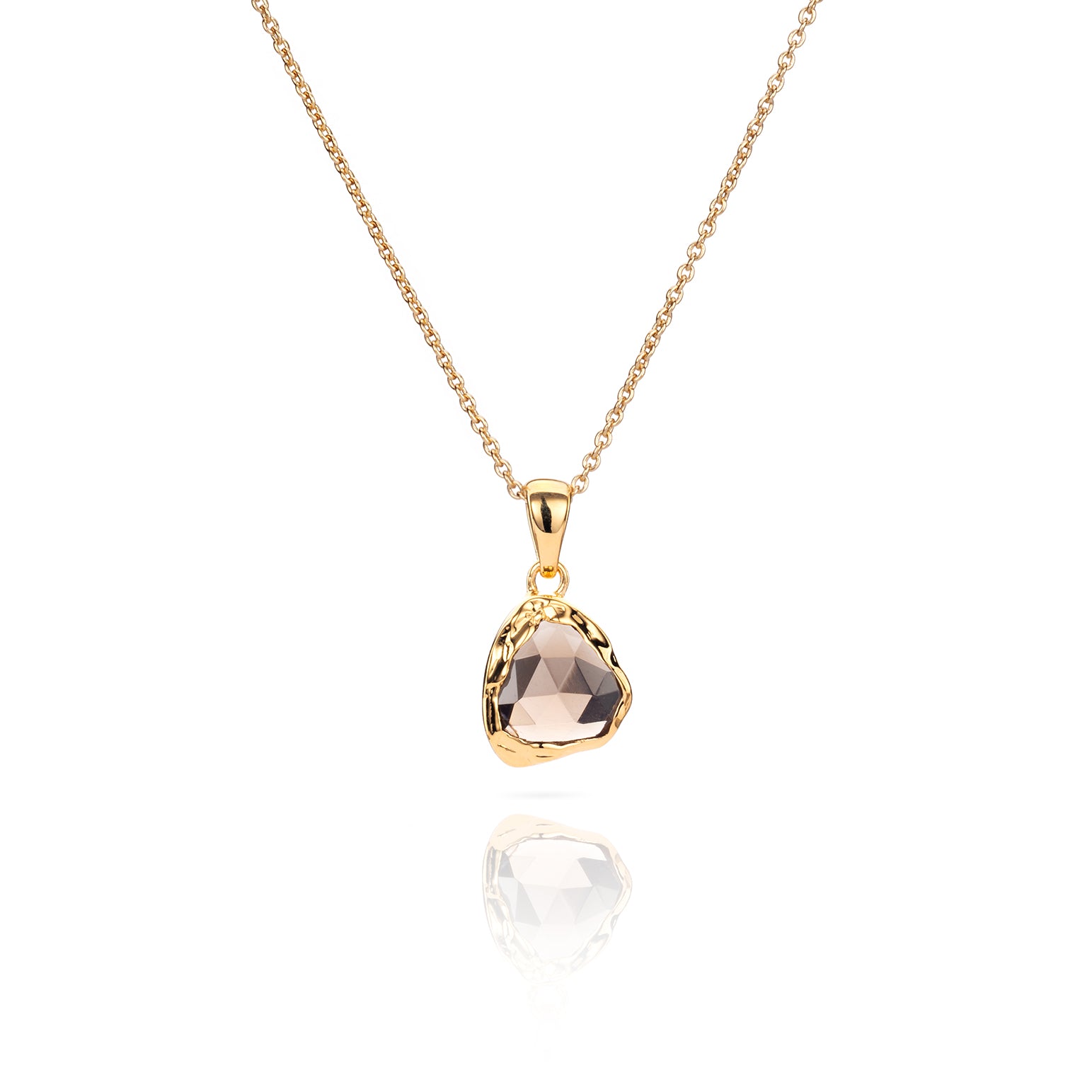 Close up of Sahara Mini gold necklace with a round gemstone pendant.