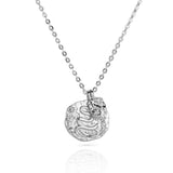 Silver snake pendant necklace with diamond details.