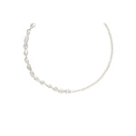 Asymmetrical pearl necklace with varying pearl sizes.