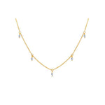 Gold chain necklace with dangling gemstones.