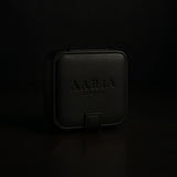 Black leather case with 'AARIA LONDON' branding on a black background