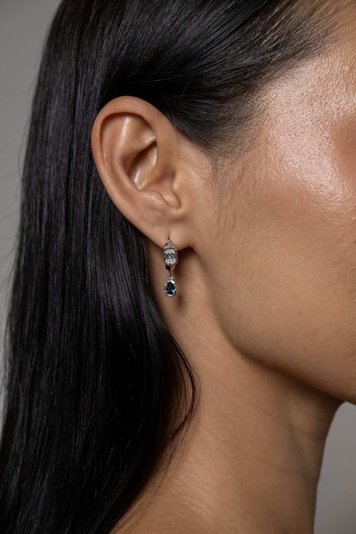 Model wearing Brooke Earrings (silver, London blue topaz)