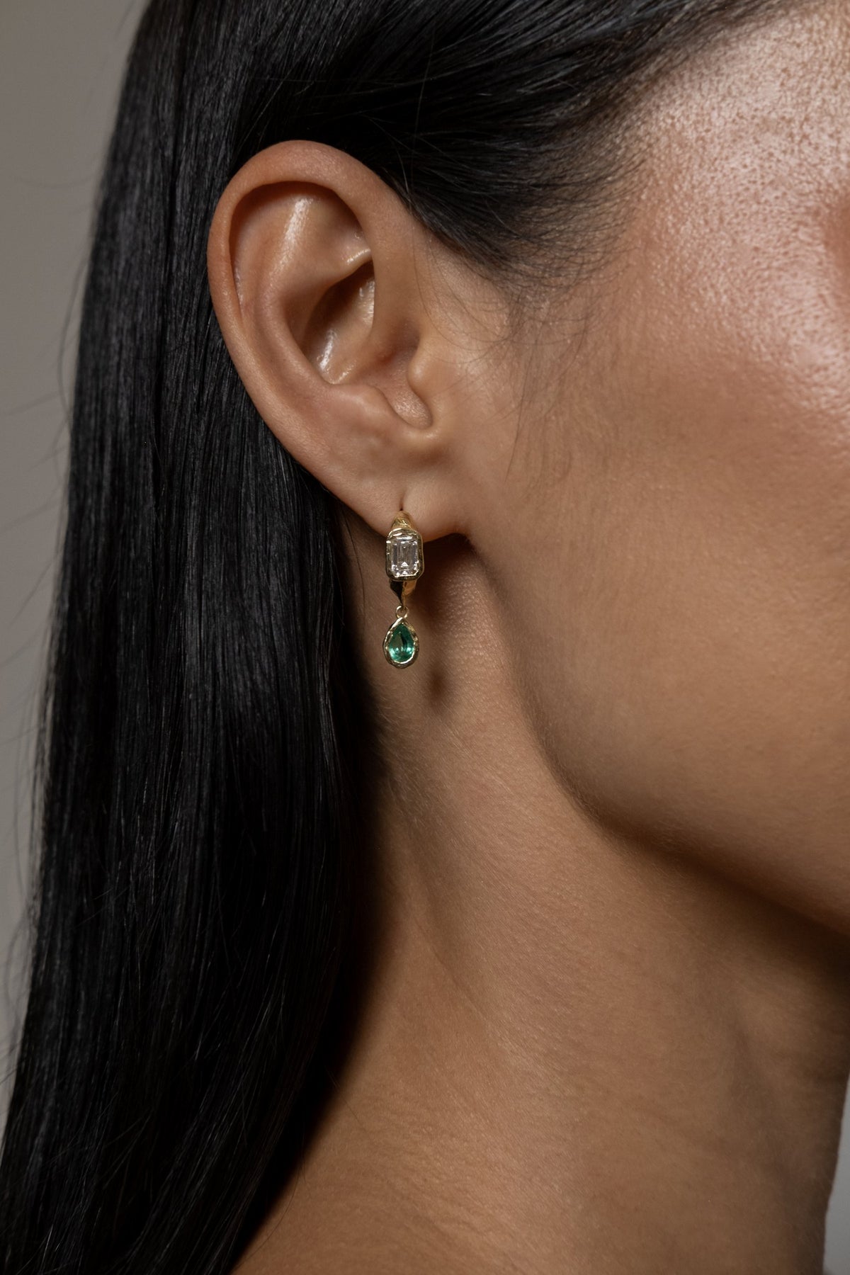 Model wearing Brooke Earrings (lab emerald)