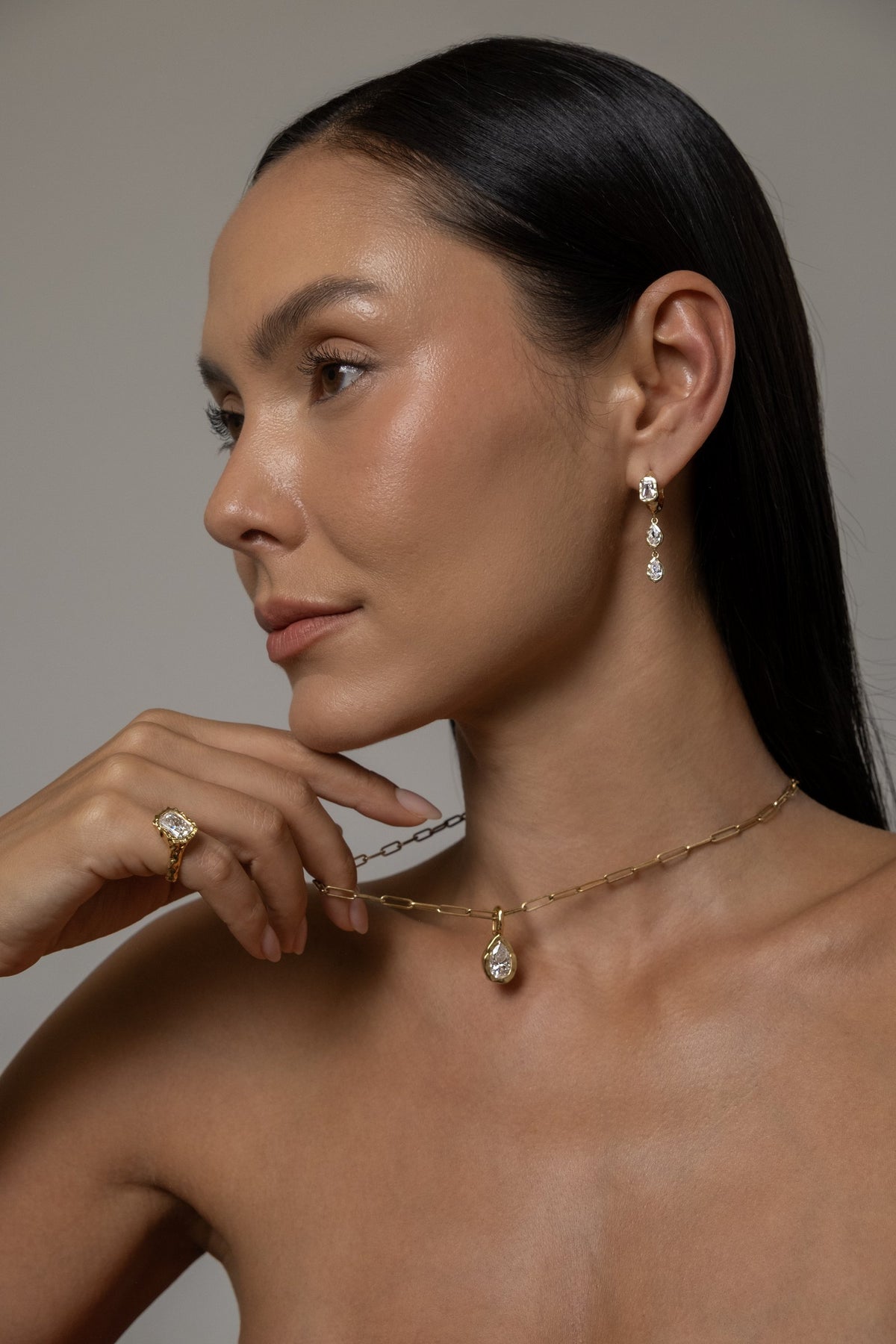 Model wearing Brooklyn Earrings (moissanite), Molten Pear Pendant (moissanite), Paperlink Chain, Molten Square Ring (moissanite)