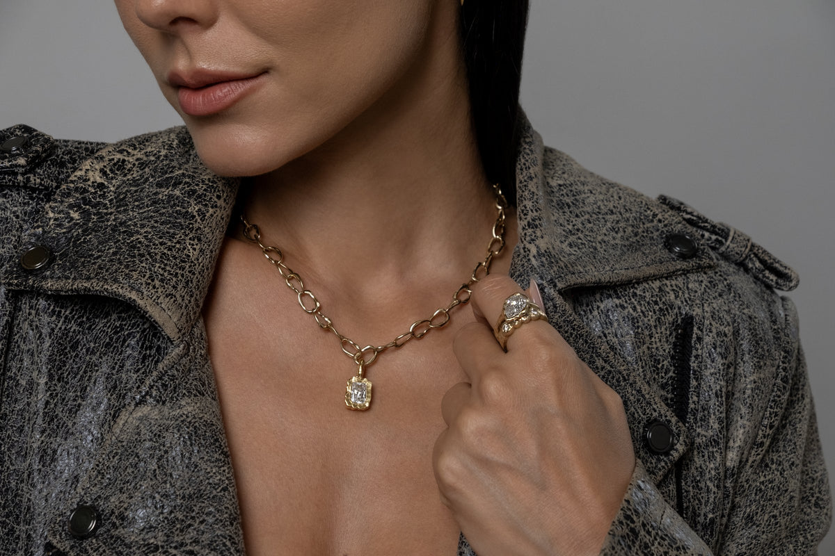 Model wearing Molten Square Pendant (moissanite), Mini Monaco Necklace, Molten Pear Ring (moissanite)