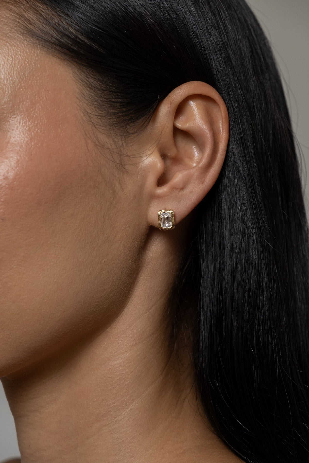 Model wearing Molten Square Studs (moissanite)