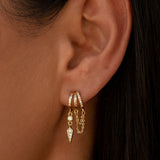 Gold Palma huggie hoops with delicate chain and spike charms