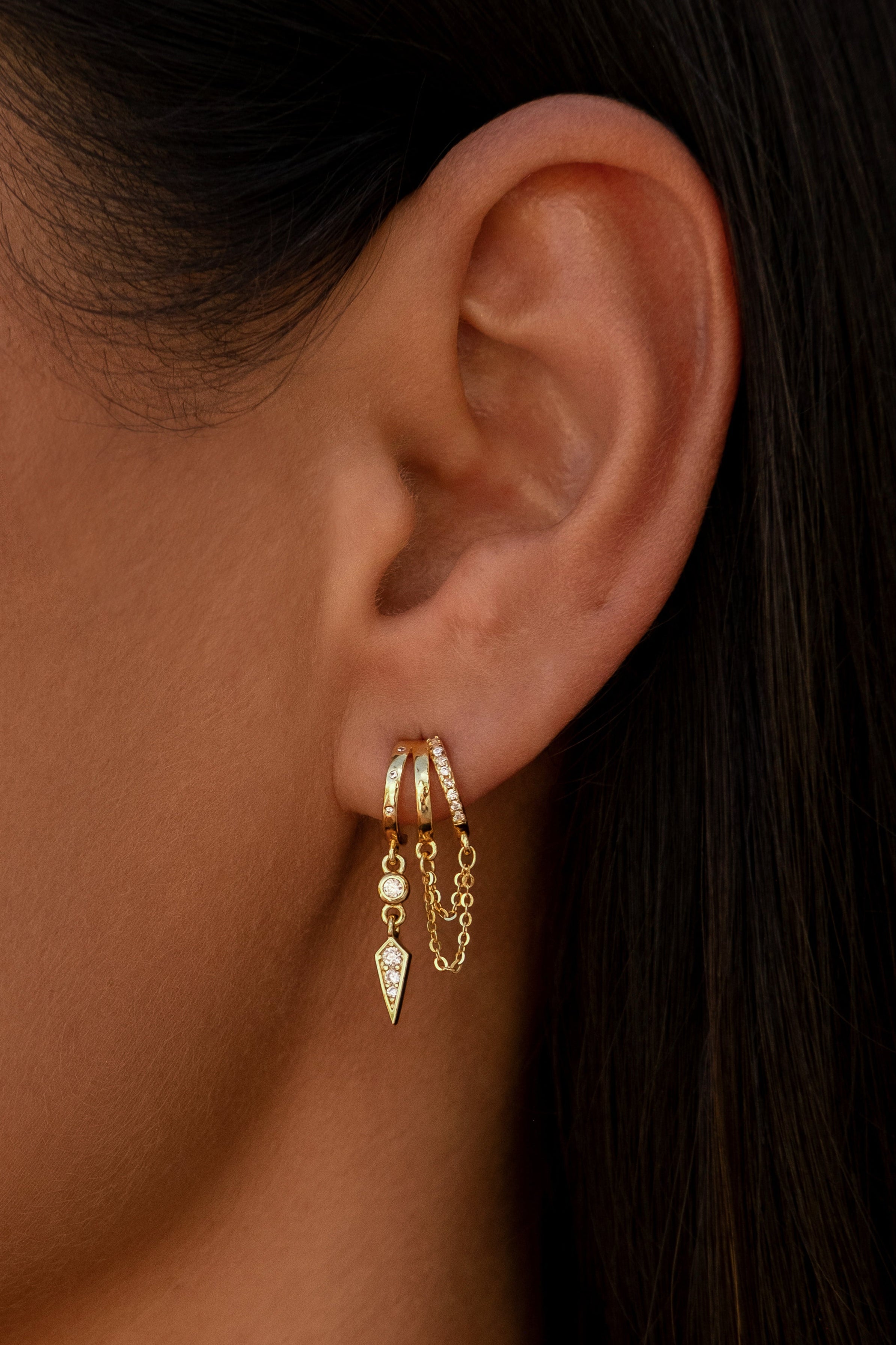 Gold Palma huggie hoops with delicate chain and spike charms